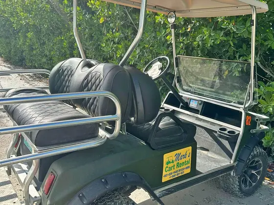 Golf cart rental with cushioned bench seating in San Pedro