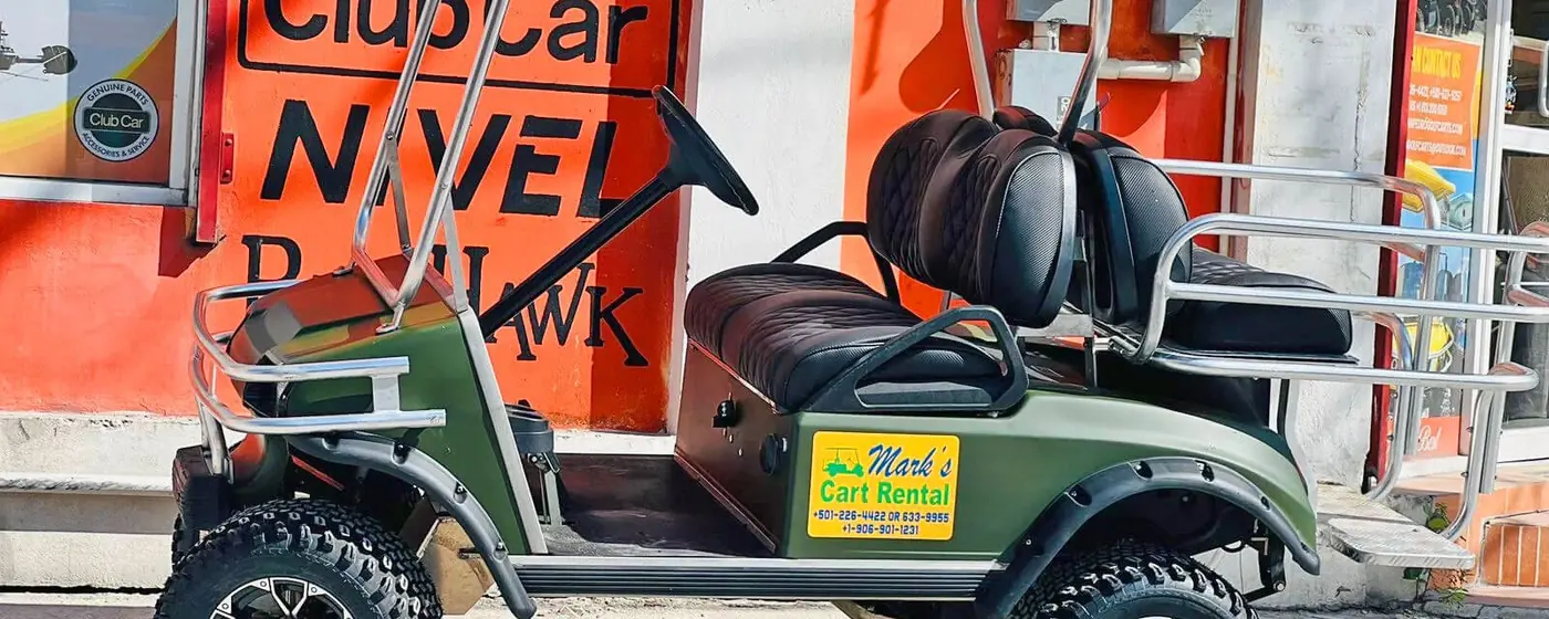 Rental golf cart photographed on the coast road in Ambergris Caye